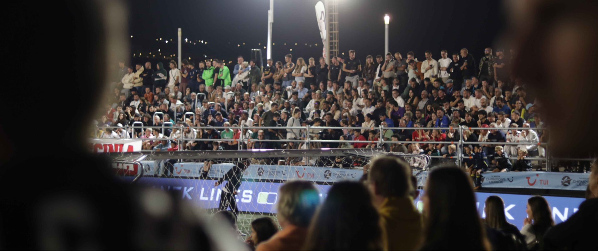6-a-side football match under floodlights